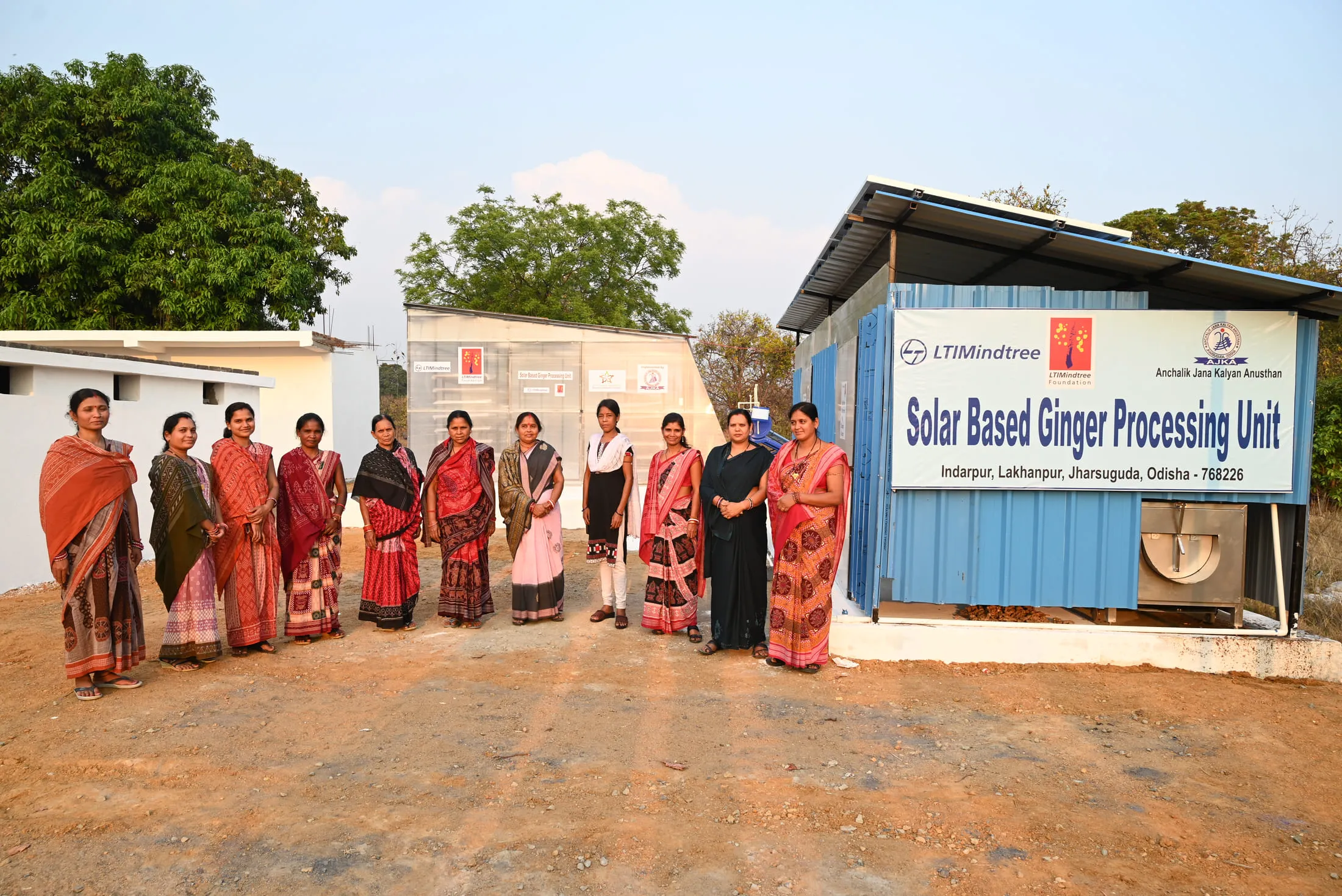 Women of the producer group outside the solar-based ginger processing unit at Indarpur